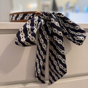 Patterned fabric and leather tie belt